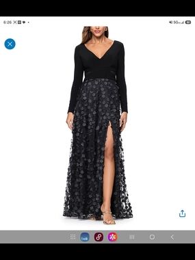 Xscape Black Long Sleeve V-Neck Gown with Floral Appliqué Skirt and High Slit